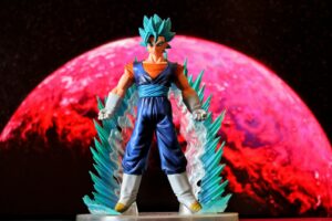 Super Saiyan Blue Dragon Ball figure posed in front of a glowing red planet